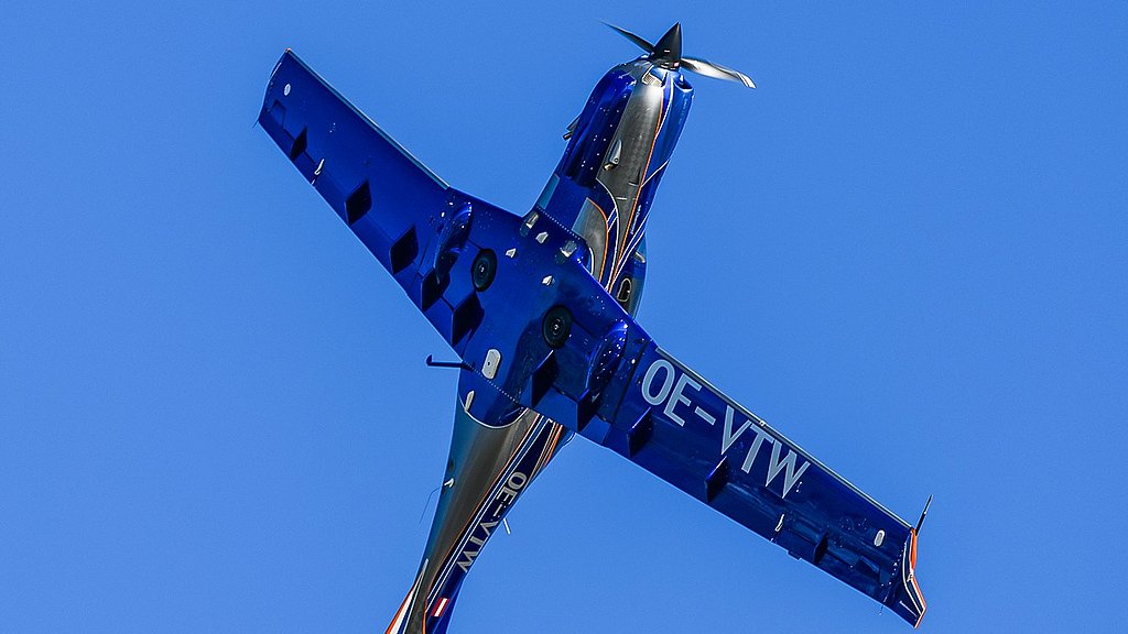 Blue DA50 RG flying in sky. 