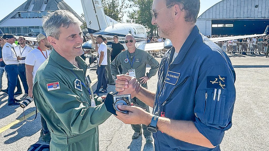 Two pilots shaking hands.