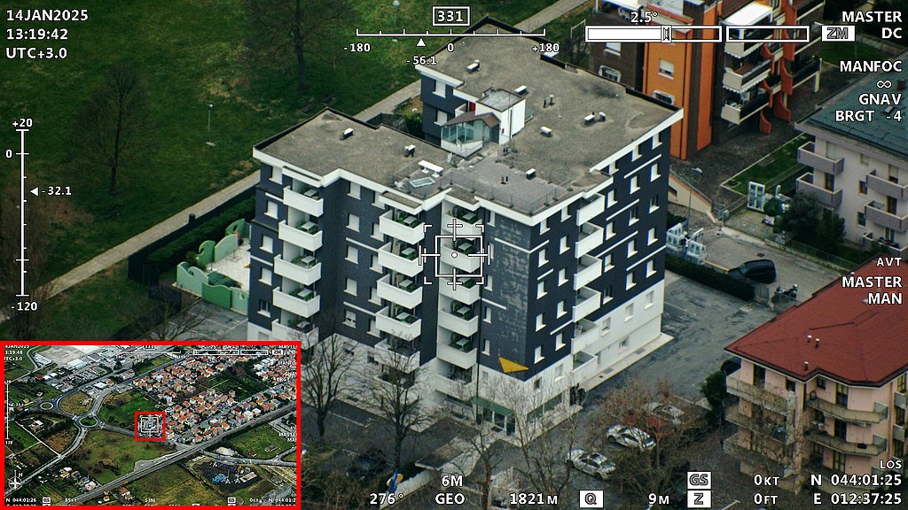 Camera screen showing a building in a residential area. 