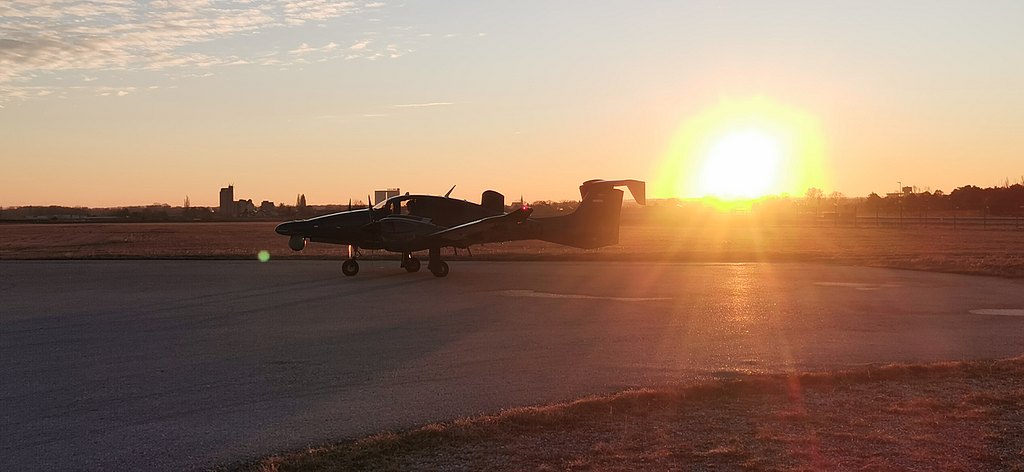 DA62 MPP on the runway during sunset.